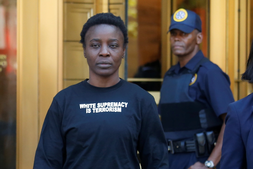Patricia Okoumou walks out of federal court from her arraignment, a day after authorities say she scaled the stone pedestal of the Statue of Liberty to protest U.S. immigration policy, in Manhattan, New York, U.S., July 5, 2018. Reuters/Shannon Stapleton