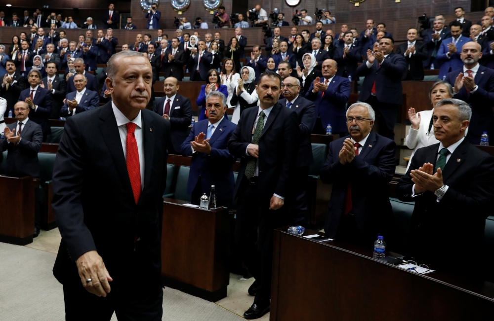 Turkey's President Tayyip Erdogan leaves his seat to address members of parliament from his ruling AK Party (AKP) at the Turkish parliament in Ankara, Turkey, July 7, 2018. REUTERS/Umit Bektas