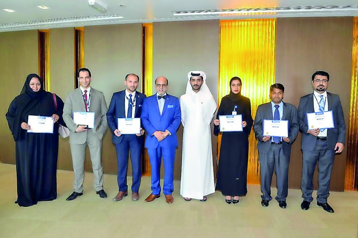 Doha Bank’s Group CEO Dr R Seetharaman (fourth left) with recepients of the ‘May 2018 Recognition Awards’ ceremony at Doha Bank tower.
