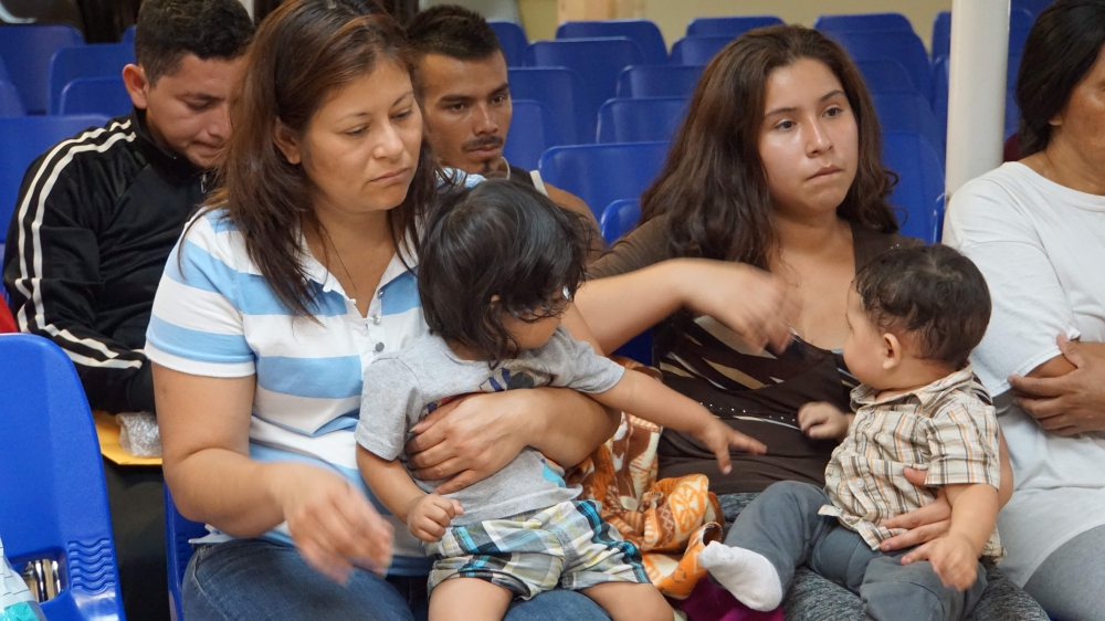 In this file photo taken on June 15, 2018 mothers and children wait to be assisted by volunteers in a humanitarian center in the border town of McAllen, Texas.  (AFP / Leila Macor) 