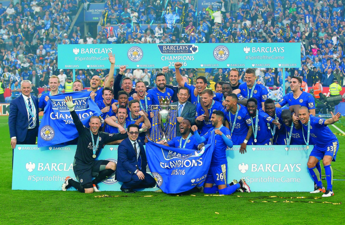 Leicester City’s players and officials celebrate with the trophy after winning the English Premier League title in this May 7, 2016 file photo.