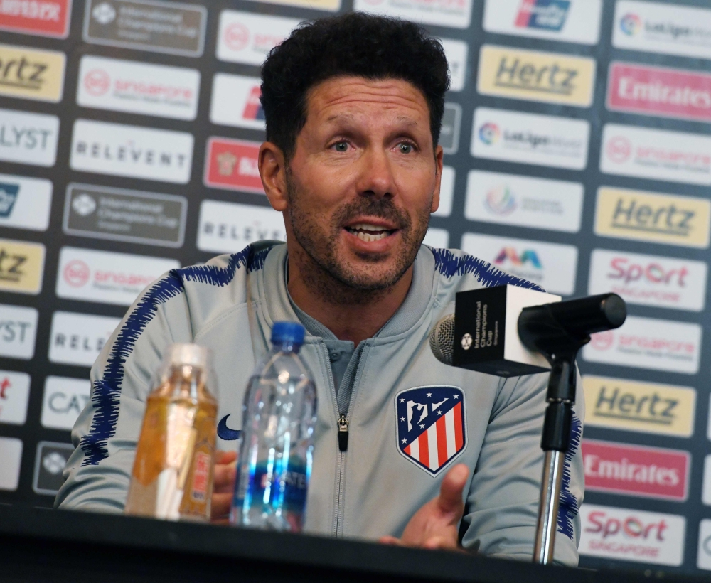 Atletico Madrid manager Diego Simeone speaks at a press conference during the pre-season tour of the International Champions Cup ahead of the match between Club Atletico de Madrid and Arsenal in Singapore on July 25, 2018. / AFP / ROSLAN RAHMAN