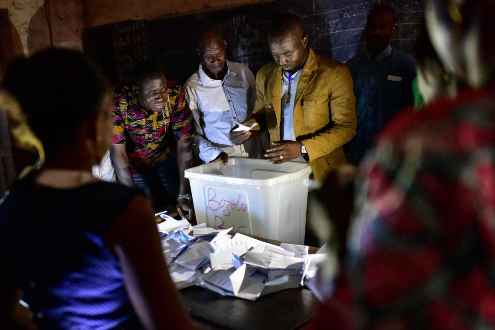 Electoral officials count ballot papers at the polling station on July 29, 2018 in Bamako, during Malian presidential elections. Mali went to the polls on July 29, 2018, with actual President seeking a second 5-year term in the fragile Sahel state beset b