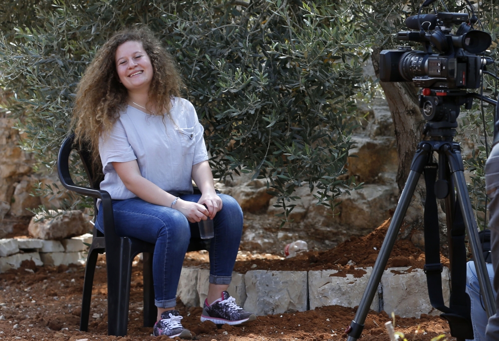 Palestinian activist and campaigner Ahed Tamimi, 17, smiles during an interview with AFP in the West Bank village of Nabi Saleh on July 30, 2018, following her release from prison yesterday after an eight-month sentence for slapping Israeli soldiers, an e