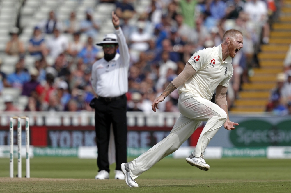 England's bowler Ben Stokes celebrates taking the wicket of India's Mohammed Shami during play on the fourth day of the first Test cricket match between England and India at Edgbaston in Birmingham, central England on August 4, 2018. (AFP / ADRIAN DENNIS)
