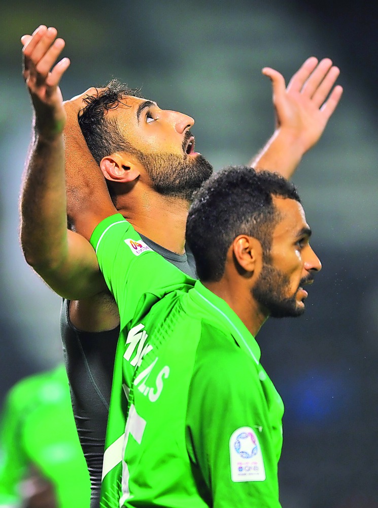 Al Ahli’s Ali Fereydoun (left) celebrates with a team-mate after scoring his second goal during their QNB Stars League match against Qatar SC at the Al Sadd Stadium yesterday. Picture by: Baher Amin / The Peninsula 
