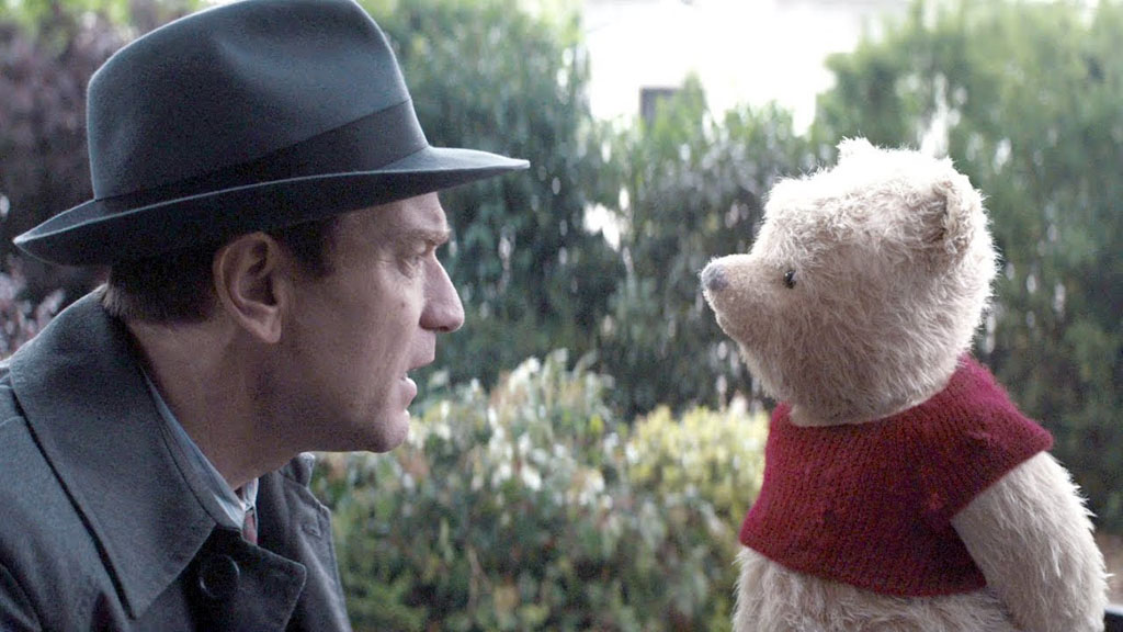 Still of the actor Ewan McGregor (L) and Pooh from the movie Christopher Robin
