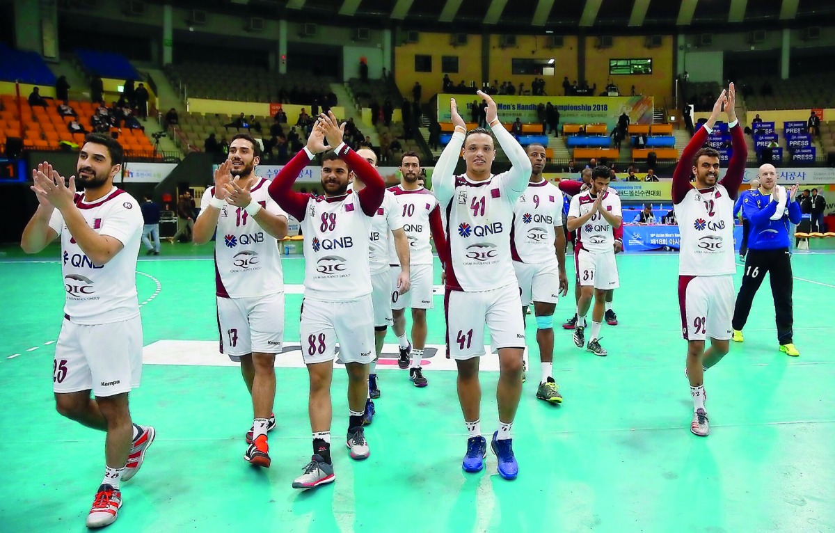 Qatar’s players celebrate after retaining their Asian Handball title in this file photo.