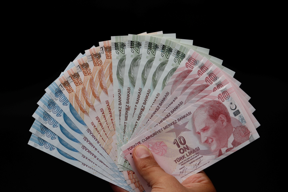 Turkish lira banknotes are seen in this picture illustration in Istanbul, Turkey August 14, 2018. Reuters/Murad Sezer