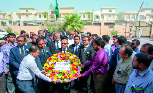 Bangladesh Ambassador Ashud Ahmed, along with embassy officials, placing floral wreaths at the portrait of the Father of the Nation, Bangabandhu Sheikh Mujibur Rahman, at the embassy premises in Doha.
