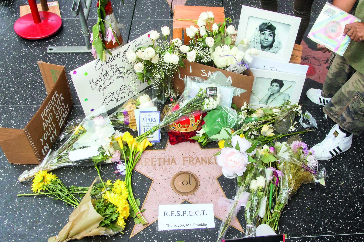 Flowers and mementos are left at a growing memorial at Aretha Franklin's star on the Hollywood Walk of Fame on August 16, 2018 in Los Angeles, California. The legendary soul singer passed away today in Detroit from pancreatic cancer at age 76. Gabriel Ols
