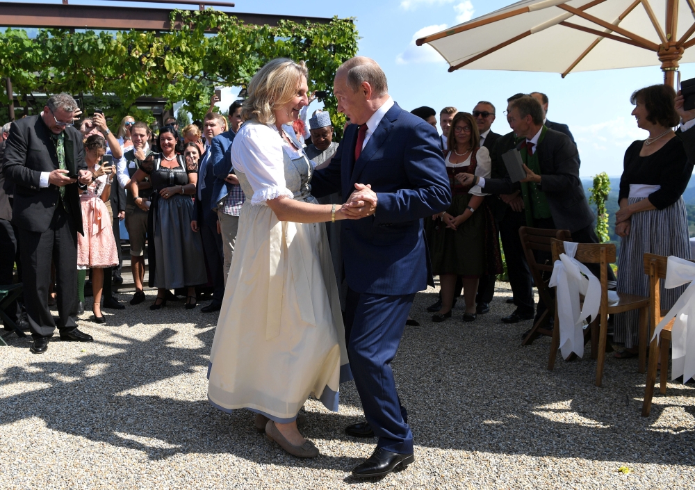 Austria's Foreign Minister Karin Kneissl dances with Russia's President Vladimir Putin at her wedding in Gamlitz, Austria, August 18, 2018. (Roland Schlager via Reuters)