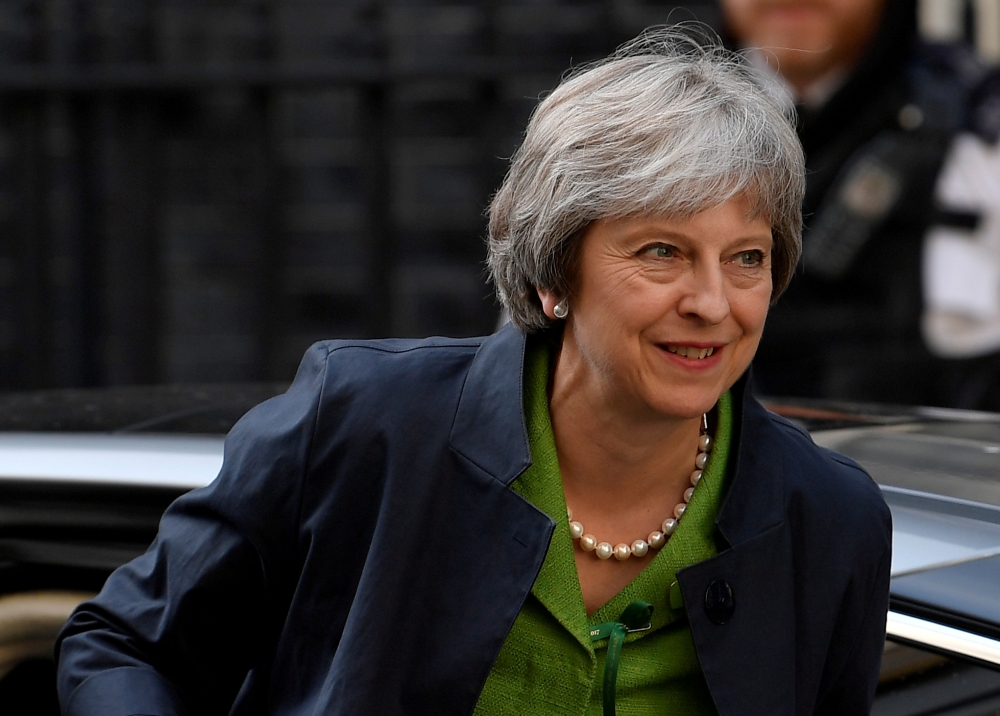 File photo of Britain's Prime Minister Theresa May returns to Downing Street from the Houses of Parliament in London, Britain, June 12, 2018. REUTERS/Toby Melville/File Photo