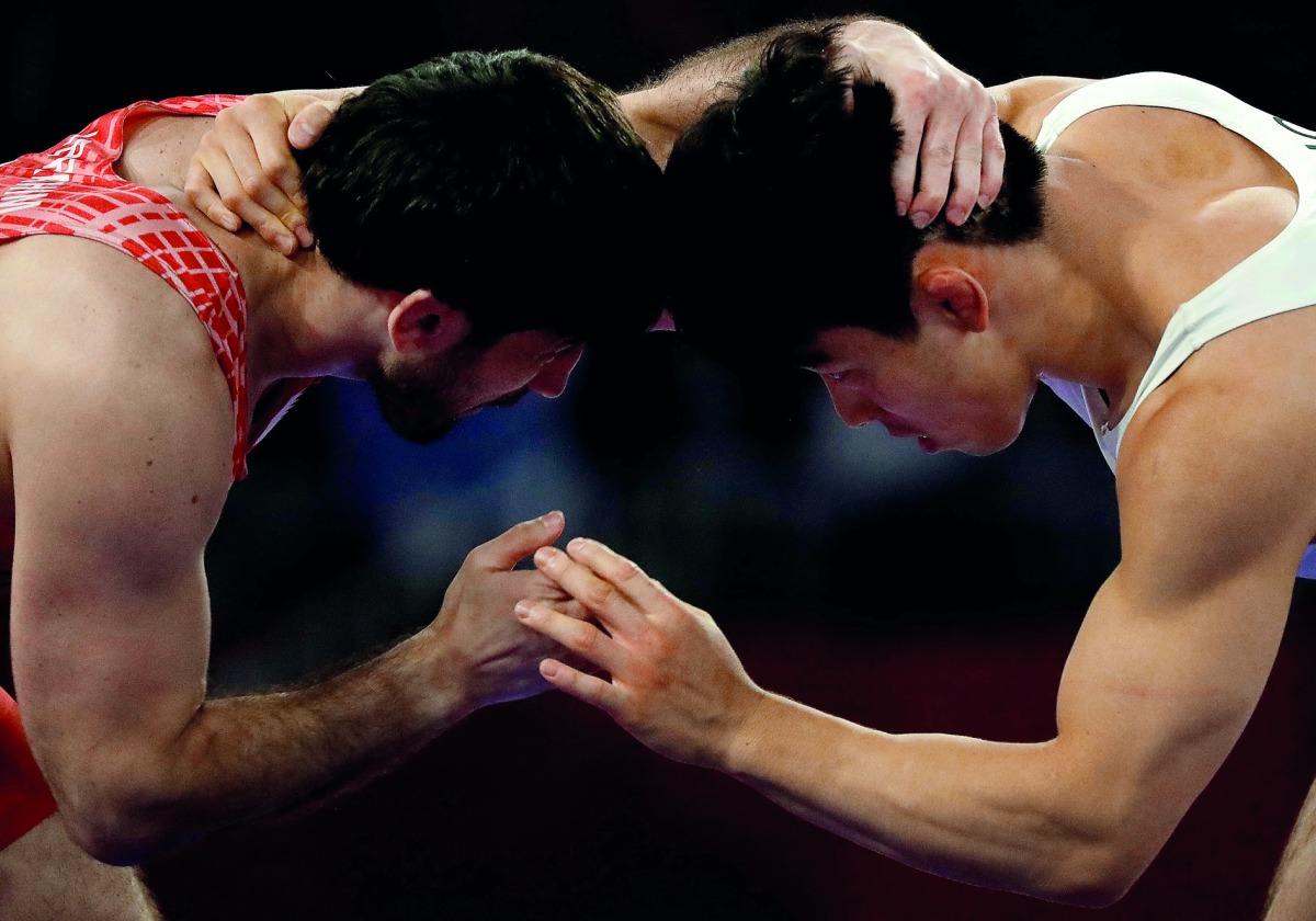 Abdullrahman Ibrahim of Qatar in action against Byungmin Gong of South Korea during the 2018 Asian Games Men’s Freestyle 74 kg bronze medal bout at the JCC  Assembly Hall in Jakarta, Indonesia, yesterday.