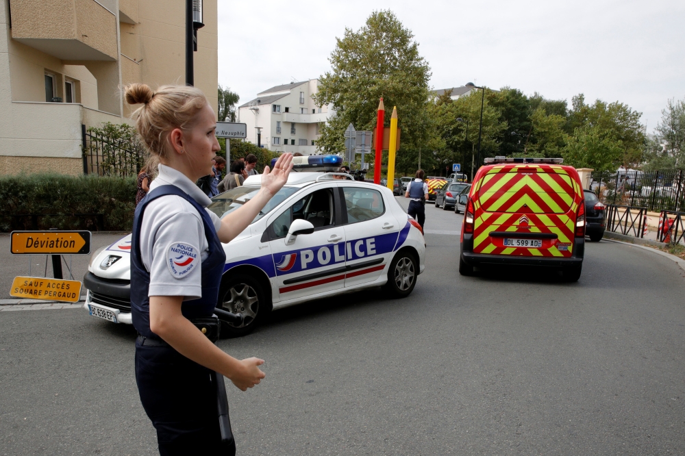 French police secure a street after a man killed two persons and injured an other in a knife attack in Trappes, near Paris, according to French authorities, France, August 23, 2018. (REUTERS/Philippe Wojazer)