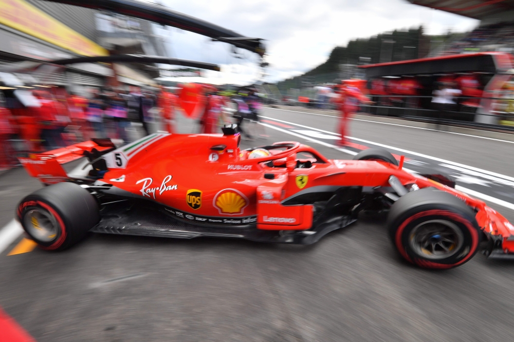 Ferrari's German driver Sebastian Vettel drives in the pits during the third practice session at the Spa-Francorchamps circuit in Spa on August 25, 2018 ahead of the Belgian Formula One Grand Prix. / AFP / EMMANUEL DUNAND