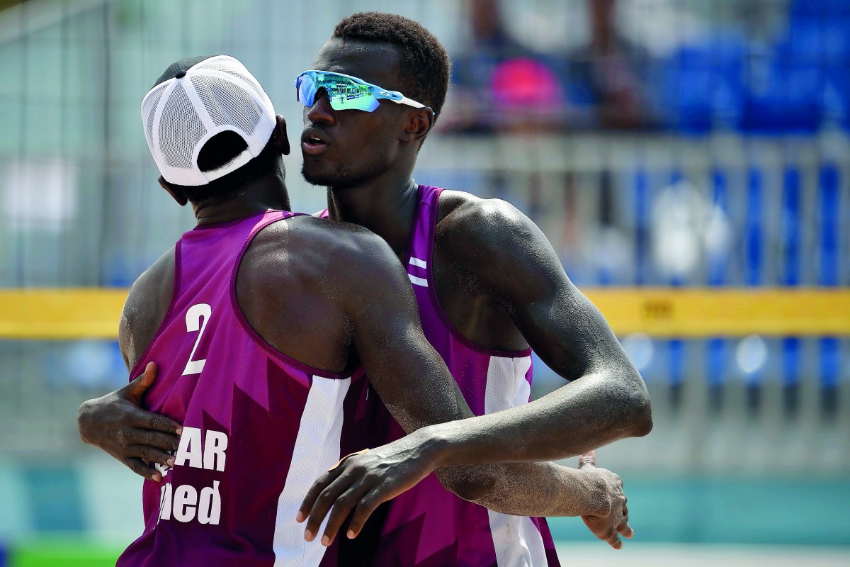 Qatar’s Janko Ahmed (left) and Samba Cherif celebrate their win in the semi-final yesterday.