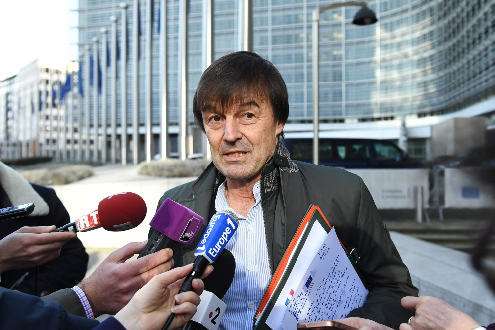 In this file photo taken on January 30, 2018 French Minister for the Ecological and Inclusive Transition Nicolas Hulot speaks to the press as he leaves the European Commission following an air quality ministerial summit at the EU headquarters in Brussels.
