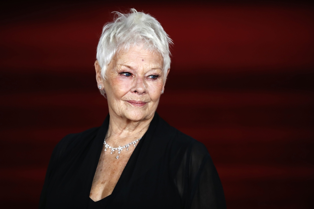 (FILE PHOTO) In this file photo taken on November 02, 2017 English actress Dame Judi Dench poses upon arrival to attend the world premiere of the film 'Murder on the Orient Express' at the Royal Albert Hall in west London.  AFP / POOL / Tolga AKMEN