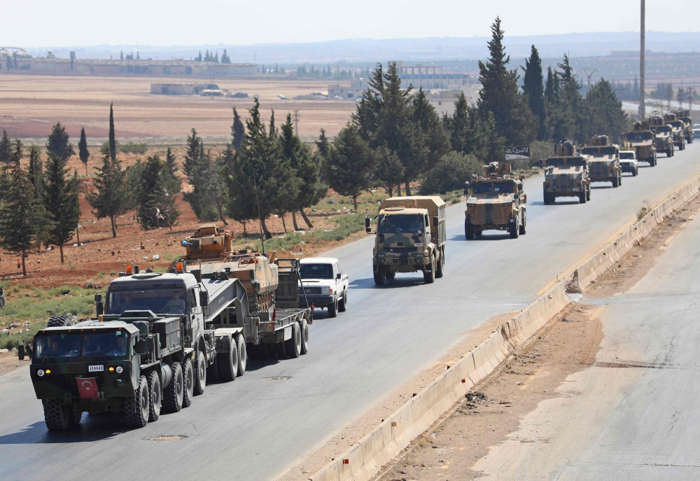 Turkish forces are seen in a convoy on a main highway between Damascus and Aleppo, near the town of Saraqib in Syria's northern Idlib province, on August 29, 2018. AFP / OMAR HAJ KADOUR