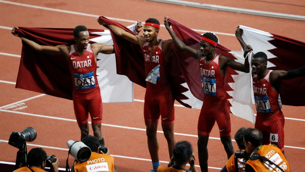 Athletes of team Qatar celebrate winning the race. Reuters/Willy Kurniawan