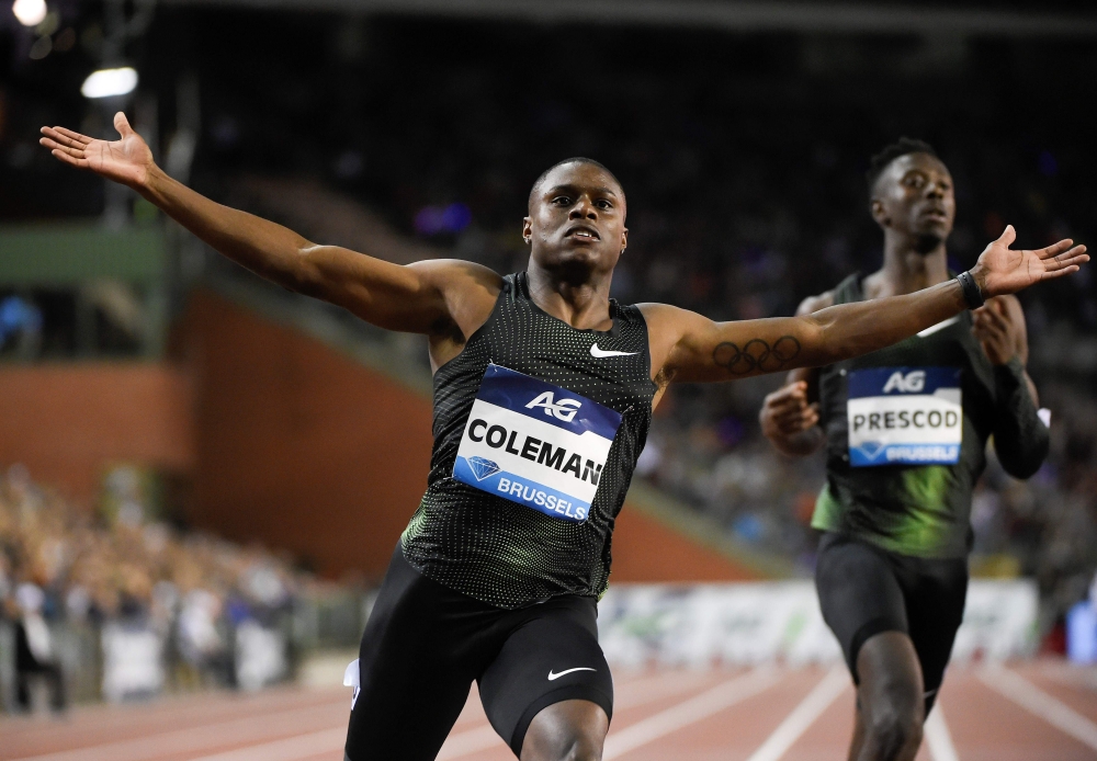 US athlete Christian Coleman (C) celebrates winning the men's 100m final of the Memorial Van Damme athletics event, the last meeting of the IAAF Diamond League competition on August 31, 2018 in Brussels. / AFP / JOHN THYS 