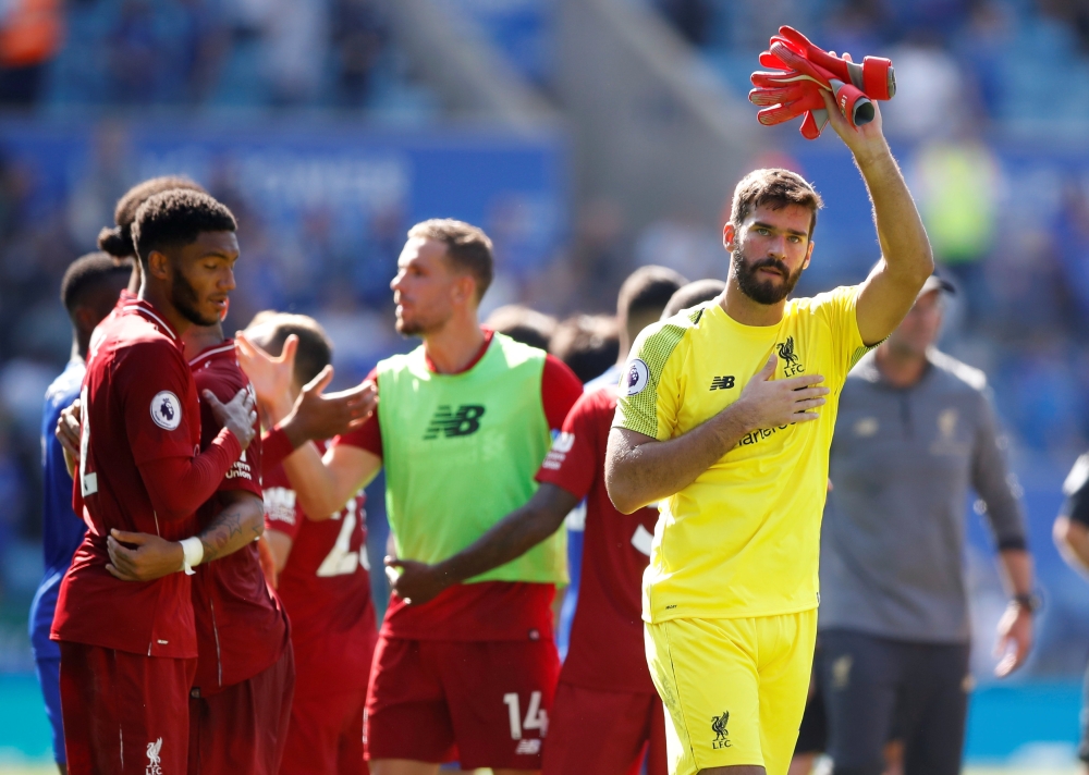 Liverpool's Alisson celebrates after the match.  Reuters/Carl Recine 
