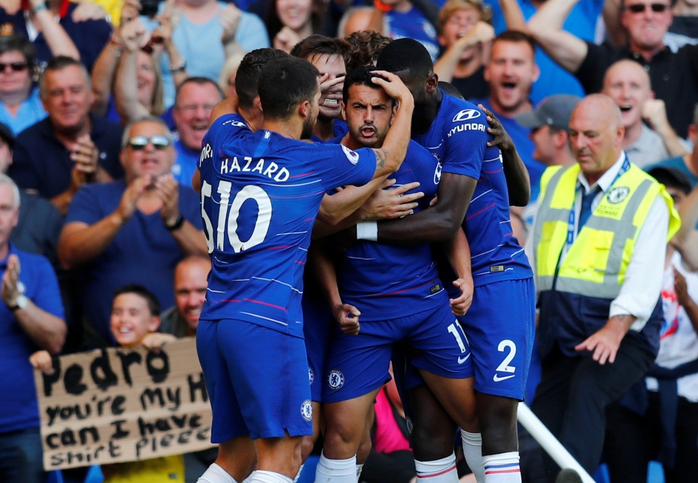 Chelsea's Pedro celebrates scoring their first goal with team mates REUTERS/Eddie Keogh 
