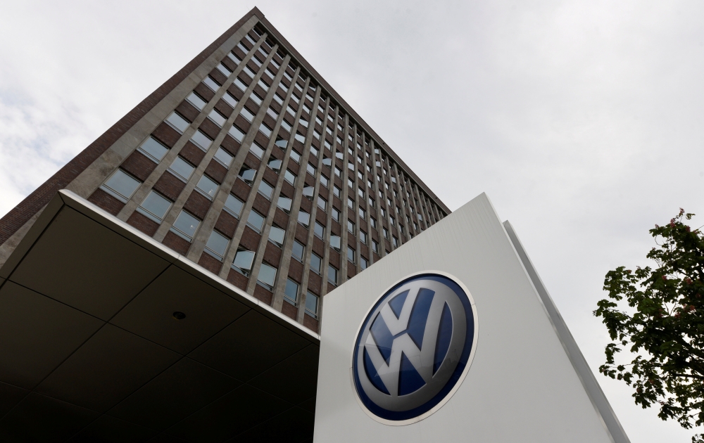 FILE PHOTO: A VW logo is seen in front of the main building of the Volkswagen brand at the Volkswagen headquarters in Wolfsburg, Germany May 19, 2017. REUTERS/Fabian Bimmer