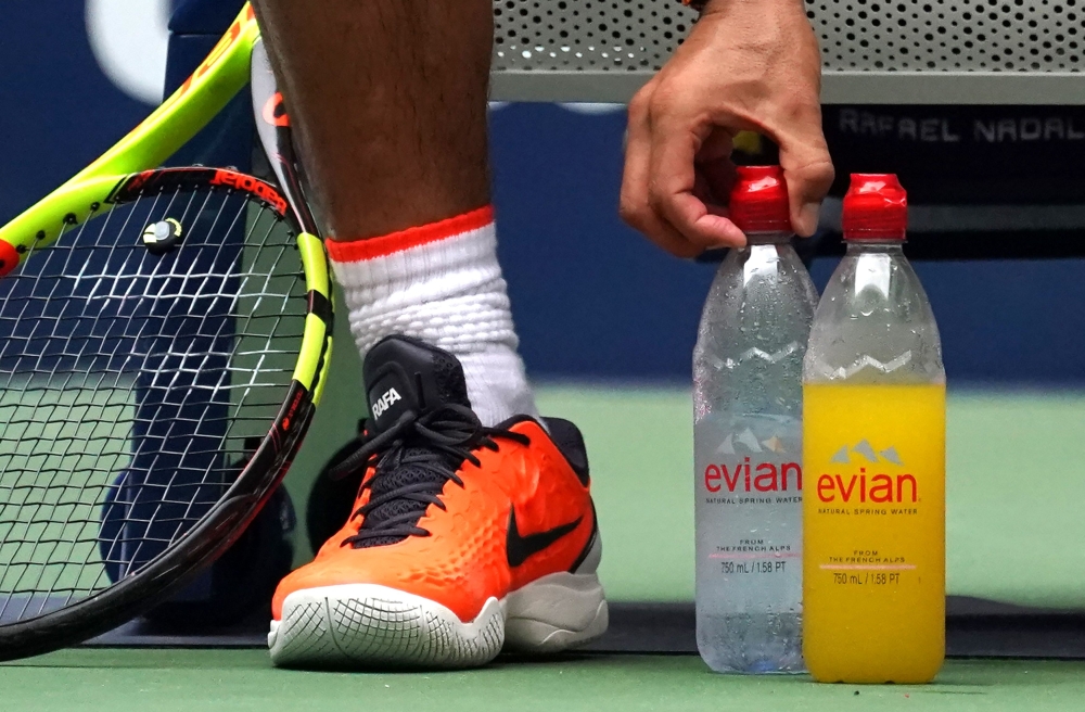 Rafael Nadal of Spain arranges his water bottles in his match against Nikoloz Basilashvili of Georgia during Day 7 of the 2018 US Open Men's Singles at the USTA Billie Jean King National Tennis Center in New York on September 2, 2018. AFP / Timothy A Clar