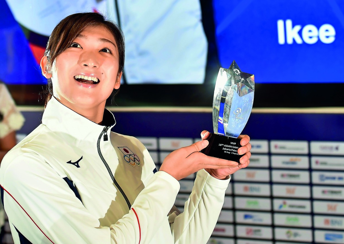 Japan's swimmer Ikee Rikako, who won six gold medals during the games, poses after being named as the