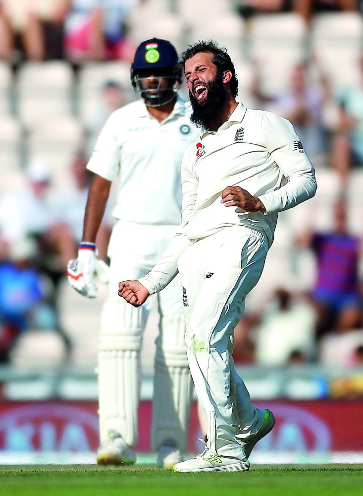 England's Moeen Ali celebrates the wicket of India's Ajinkya Rahane. Action Images via Reuters/Paul Childs