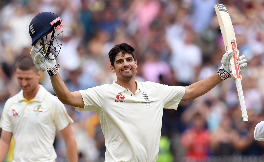 (FILES) In this file photo taken on December 28, 2017 England's batsman Alastair Cook (R) celebrates scoring his double century against Australia on the third day of the fourth Ashes cricket Test match at the MCG in Melbourne. AFP / WILLIAM WEST