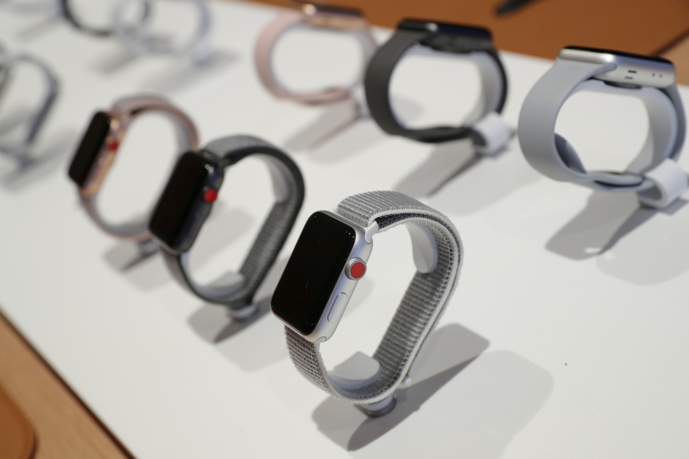 FILE PHOTO: Apple watches are seen at a new Apple store in Chicago, Illinois, U.S., October 19, 2017. REUTERS/John Gress