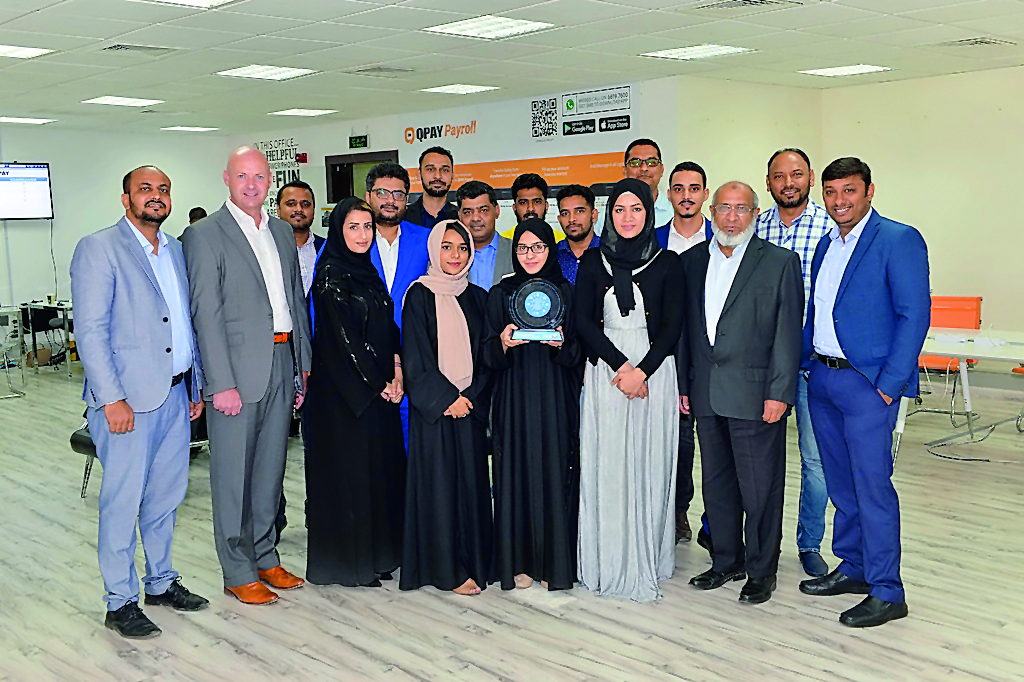 QPAY’s Group senior officials posing for a photo with the award.