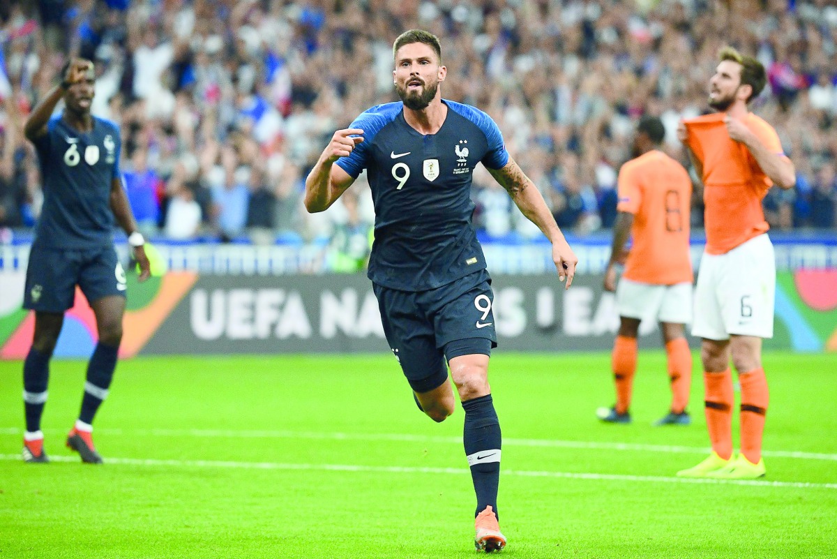 France's forward Olivier Giroud celebrates after scoring a goal during the UEFA Nations League football match between France and Netherlands at the Stade de France stadium, in Saint-Denis, northern Paris, on September 9, 2018.  AFP / Franck Fife 