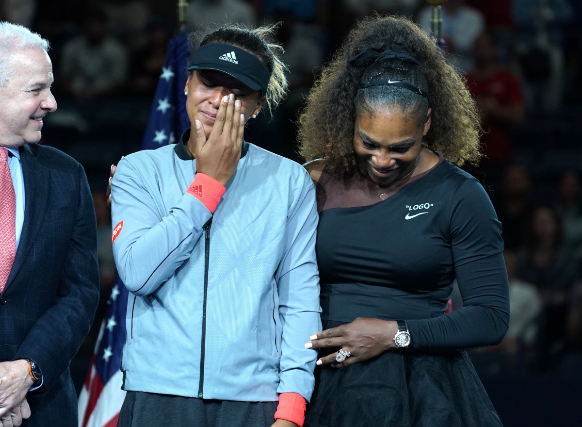 US Open Womens Single champion Naomi Osaka of Japan (L) with Serena Williams of the US during their Women's Singles Finals match at the 2018 US Open at the USTA Billie Jean King National Tennis Center in New York on September 8, 2018.  AFP / Timothy A Cla