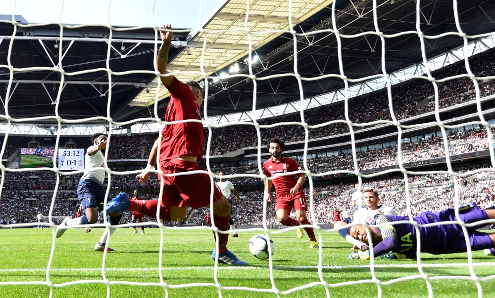 Liverpool's Roberto Firmino scores their second goal REUTERS/Dylan Martinez 
