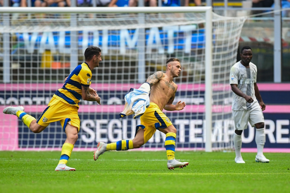 Parma's Italian defender Federico Dimarco (C) celebrates after opening the scoring during the Italian Serie A football match Inter Milan vs Parma on September 15, 2018 at the San Siro stadium in Milan. / AFP / Miguel MEDINA