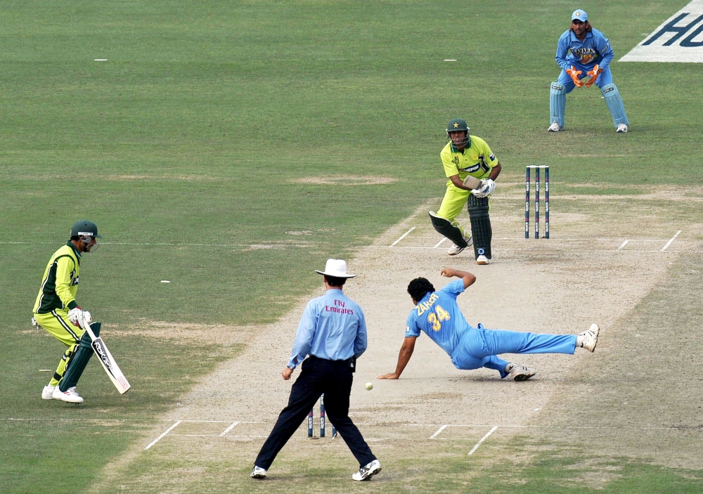 (FILES) In this file photo taken on February 13, 2006 Indian bowler Zaheer Khan (C) drops a catch off Pakistani batsman Imran Farhat (2nd from top) during the third one day international match between Pakistan and India at the Gaddafi Cricket Stadium in L