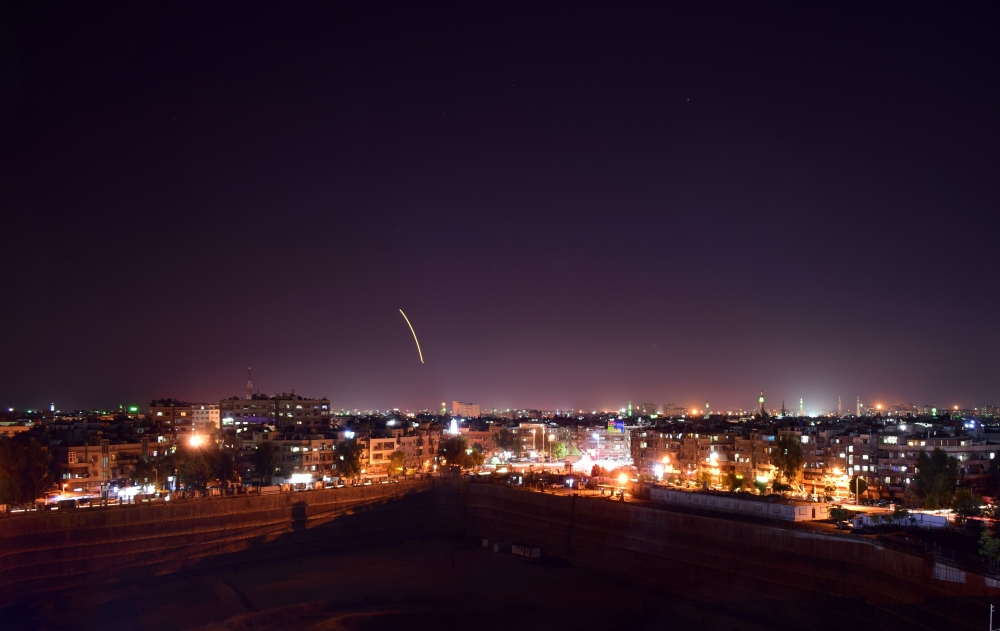 Syrian air defence batteries responding to what the Syrian state media said were Israeli missiles targeting Damascus international airport. AFP / SANA