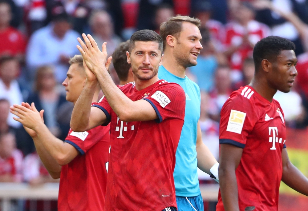 Bayern Munich's Robert Lewandowski applauds fans after the match REUTERS/Michael Dalder 
