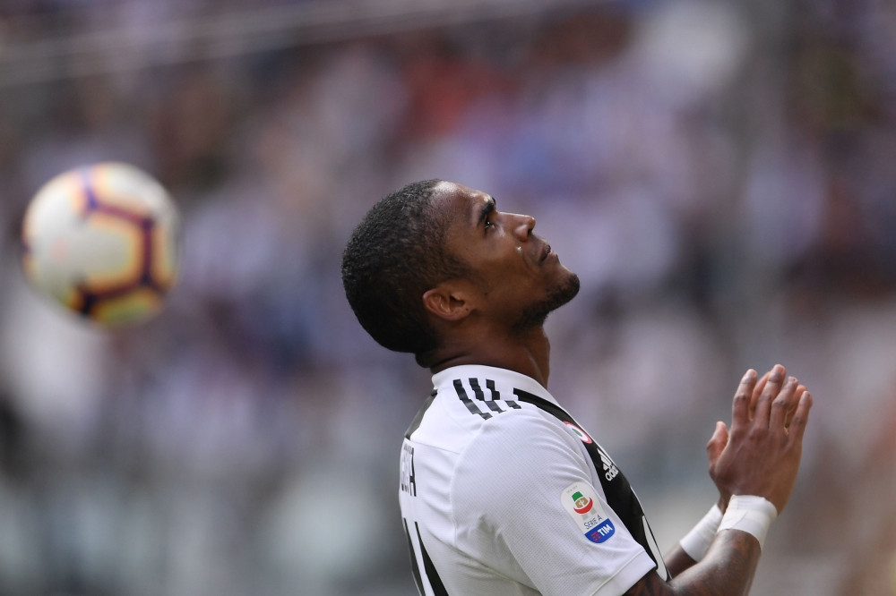 Juventus' Brazilian forward Douglas Costa. AFP / Marco BERTORELLO