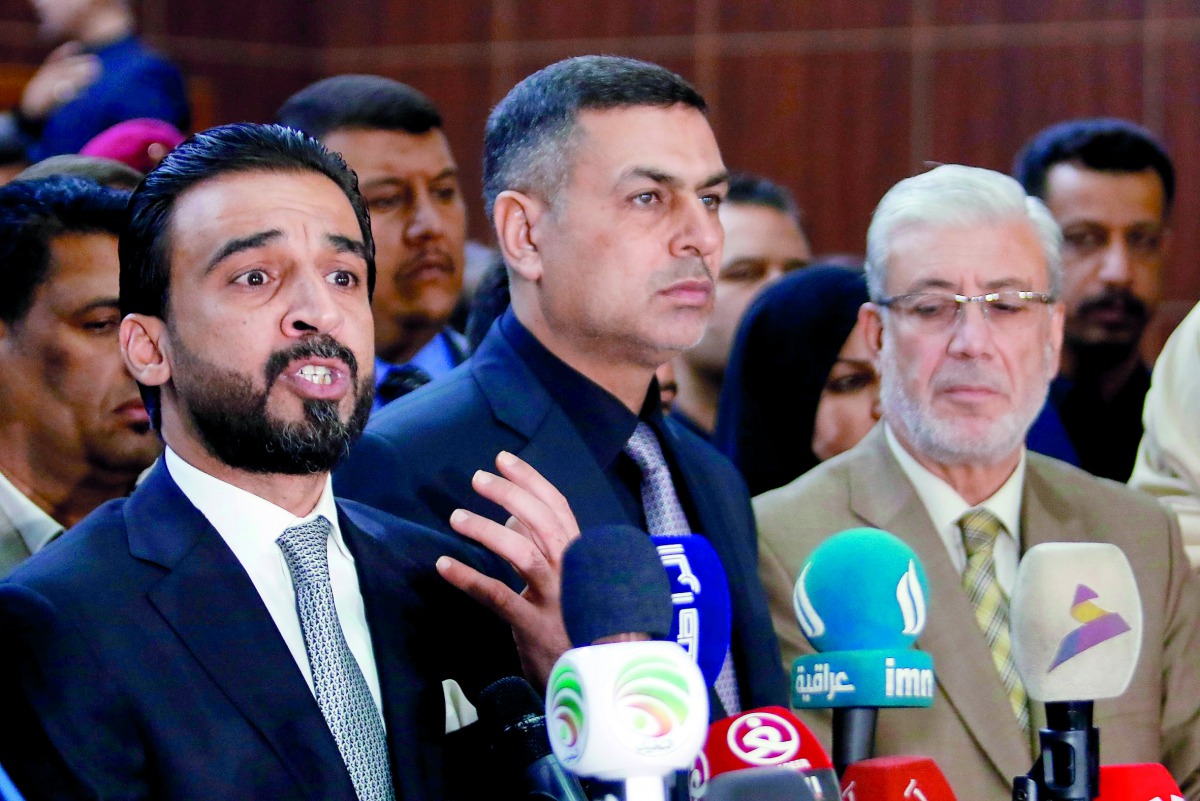 Mohammed al-Halbusi (L), newly elected speaker of the Iraqi Parliament, delivers a speech on September 18, 2018, following a meeting in Basra. AFP / Haidar Mohammed Ali
