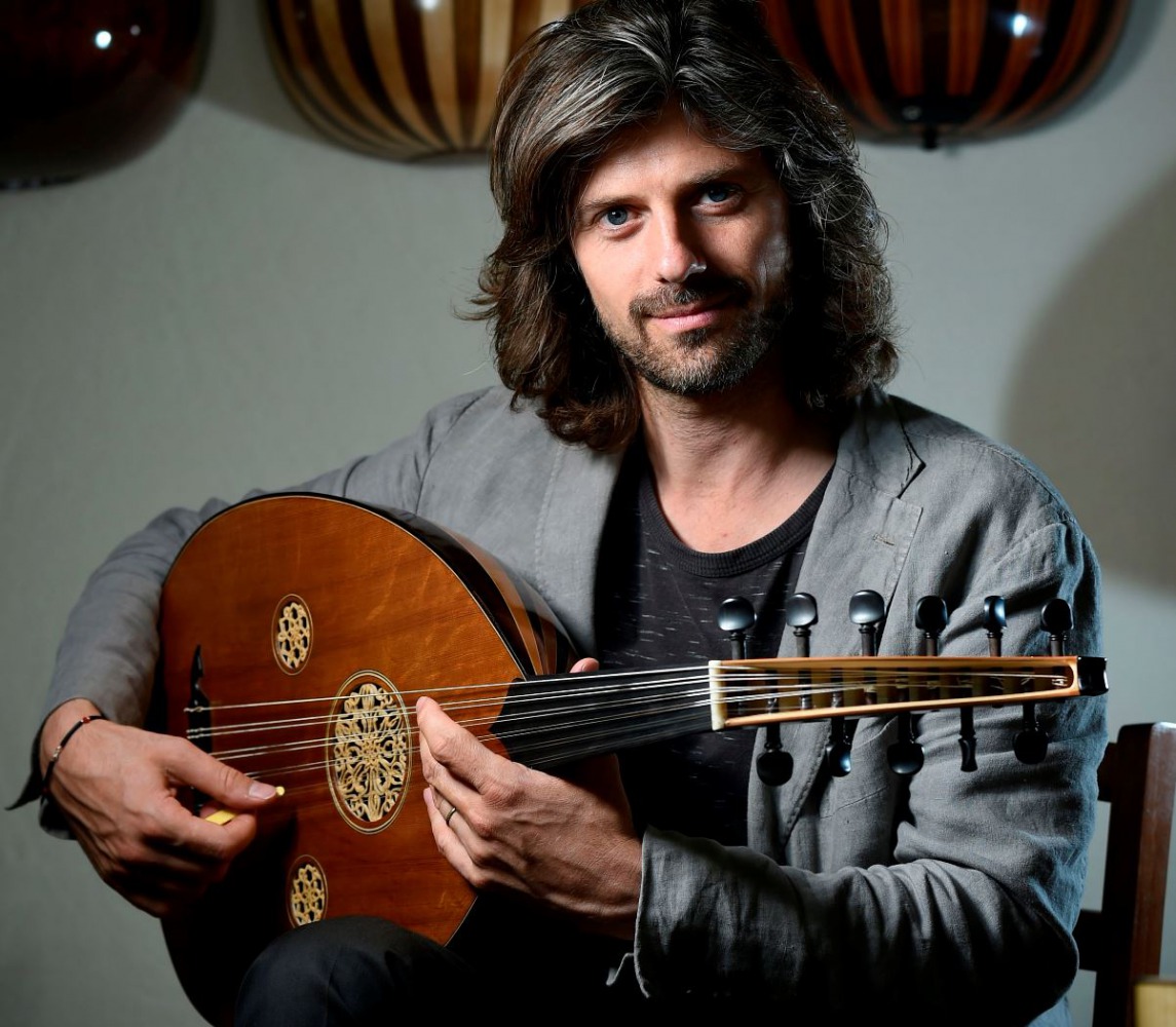 Belgian Artistic director and oud player Tristan Driessens poses for a picture during an interview in Brussels on June 22, 2018. AFP / JOHN THYS