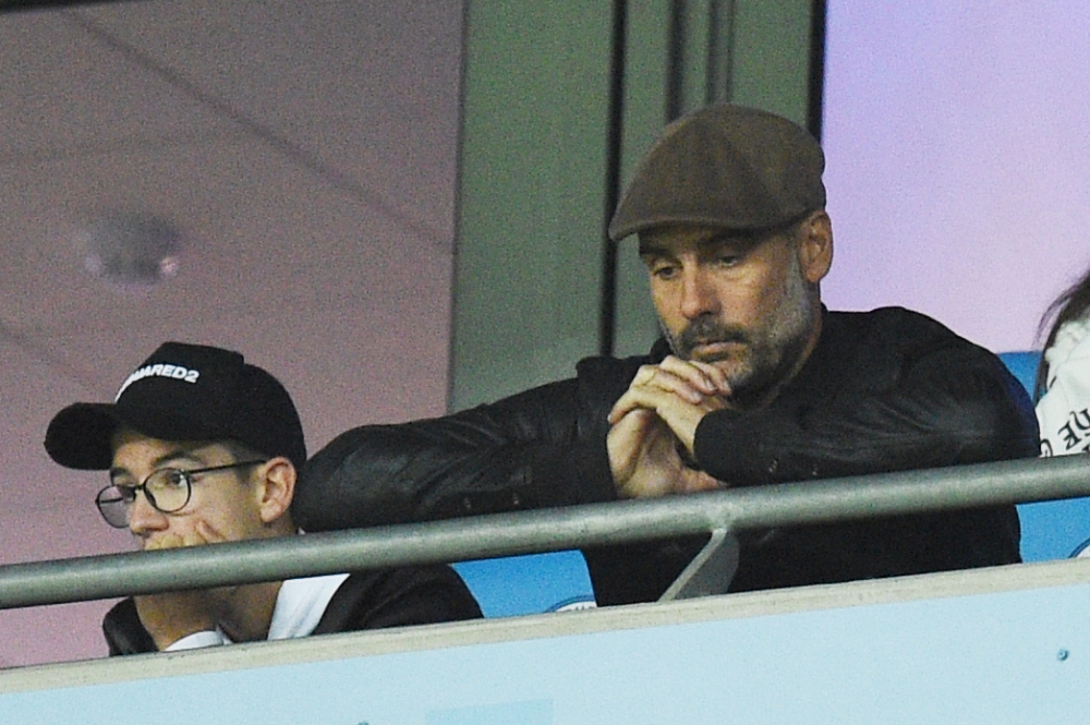 Manchester City's Spanish manager Pep Guardiola reacts during the UEFA Champions League group F football match between Manchester City and Lyon at the Etihad Stadium in Manchester, north west England, on September 19, 2018. / AFP / Oli SCARFF