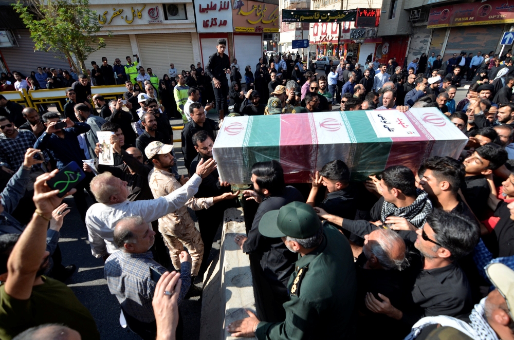 People gather during a funeral of the victims of assault that killed 25 people, in the streets of the southwestern Iranian city of Ahvaz , Iran September 24, 2018. Tasnim News Agency