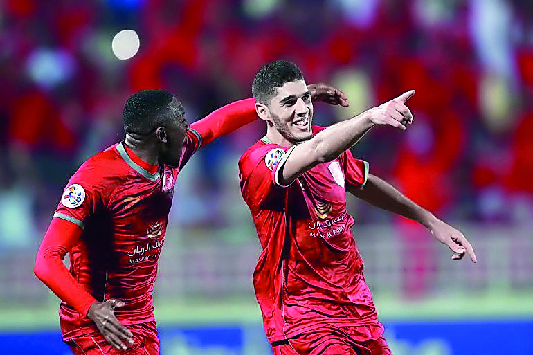 Al Duhail’s Karim Boudiaf (right) celebrates with a team-mate after scoring against Iran's Zob Ahan Esfahan FC in this file photo.