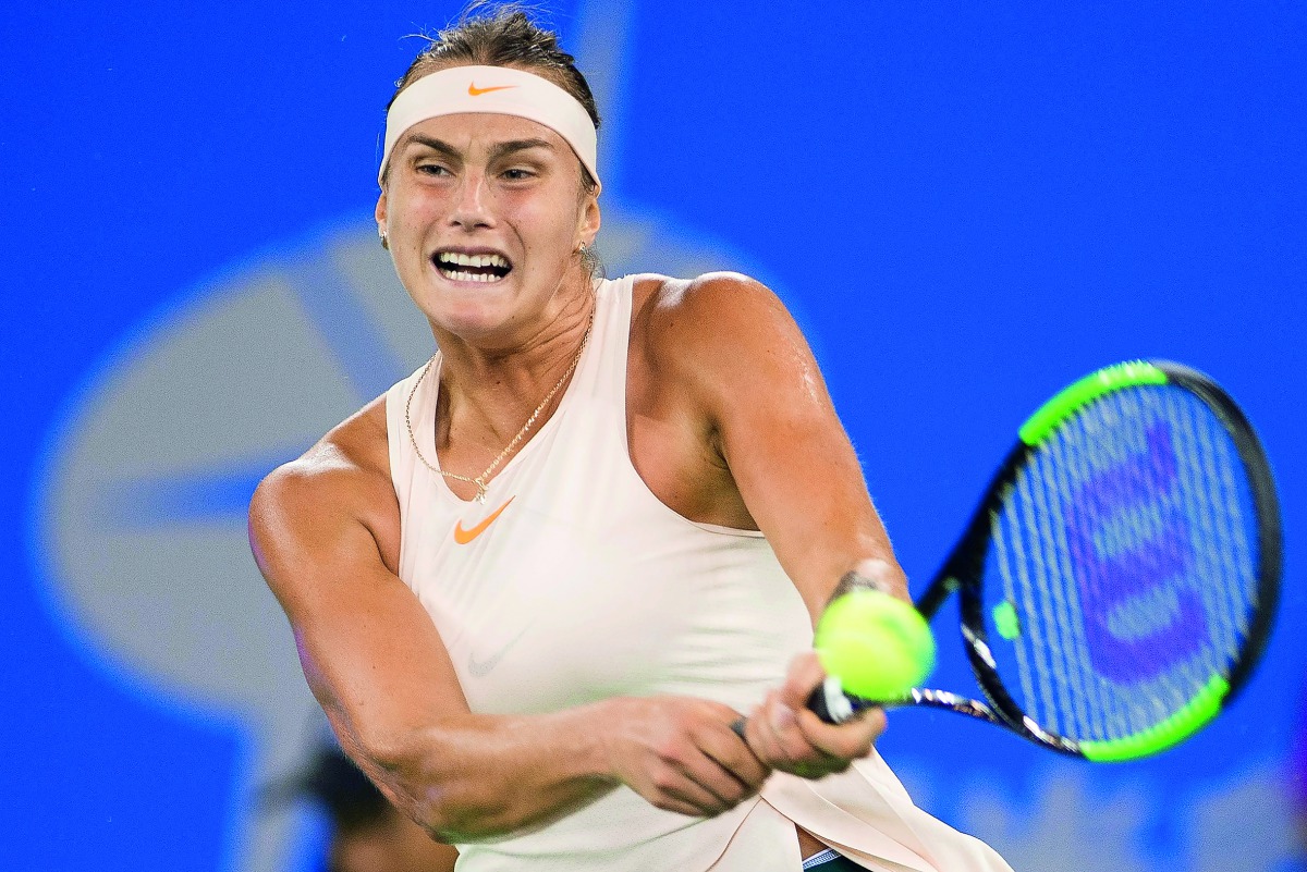 Aryna Sabalenka of Belarus hits a return against Ashleigh Barty of Australia during their women's singles semi-final match at the WTA Wuhan Open tennis tournament in Wuhan on September 28, 2018. AFP / Nicolas Asfouri
