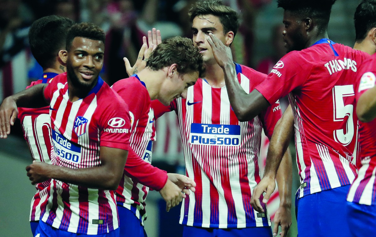 Atletico Madrid players  celebrate after Antoine Griezmann scored a goal during the La Liga match between Atletico Madrid and Huesca at Wanda Metropolitano on September 25, 2018 in Madrid, Spain. (Burak Akbulut - Anadolu Agency) 

